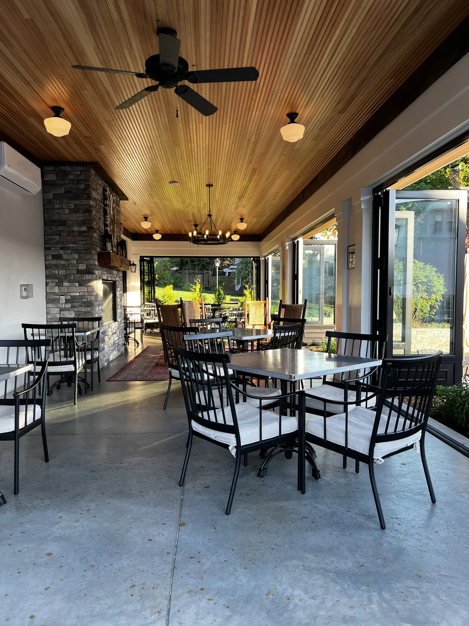The dining room and stone fireplace at the Tubmill Creek Provisions cafe in Ligonier